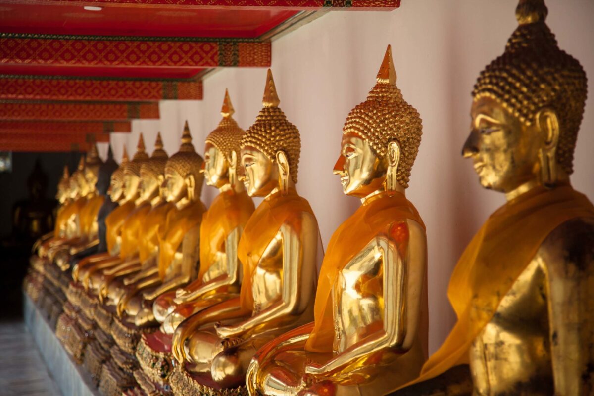 Wat Po temple Buddha sitting in line and meditating Thailand